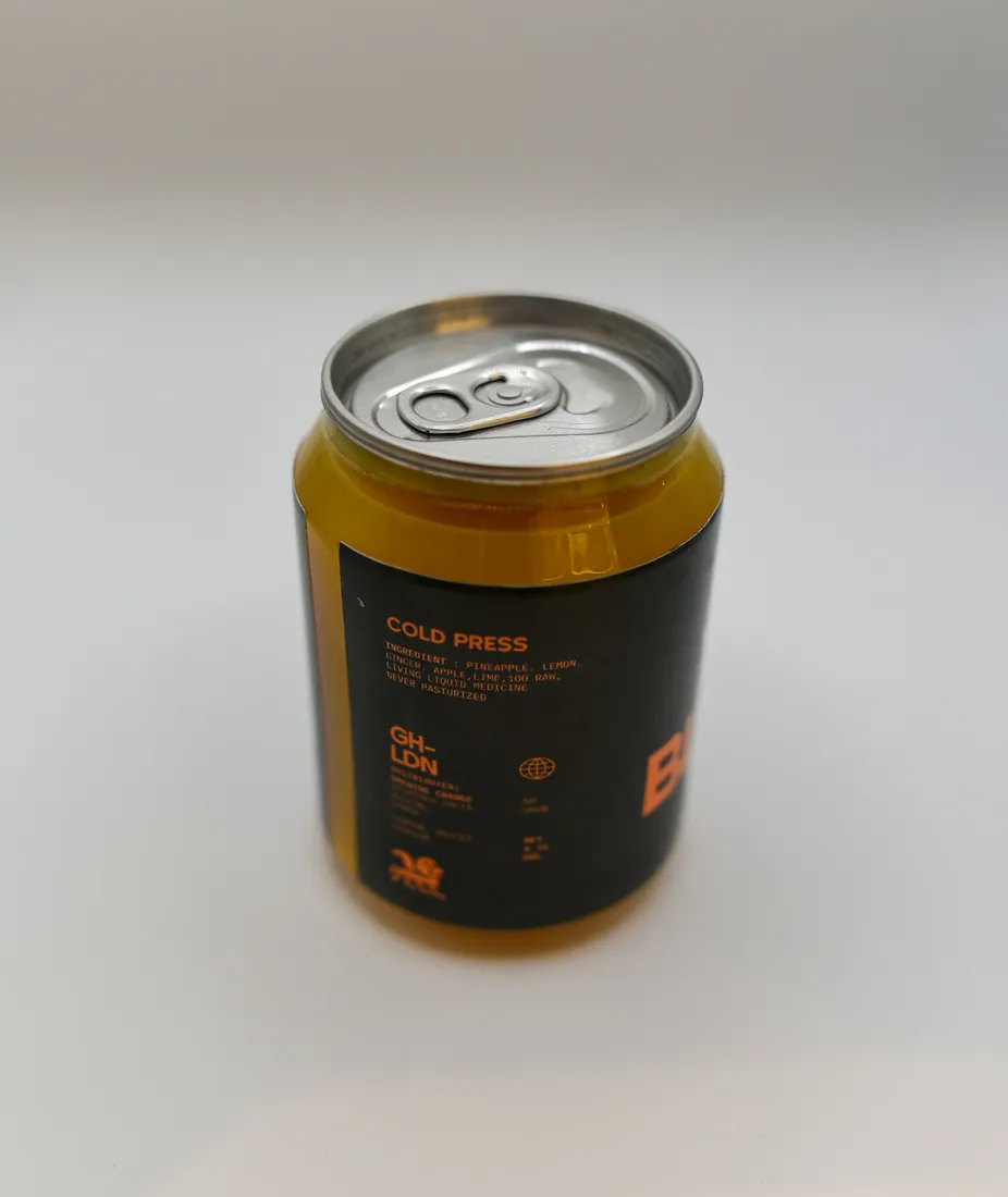 The back label of a black Brewing Change juice can, headed Cold Press