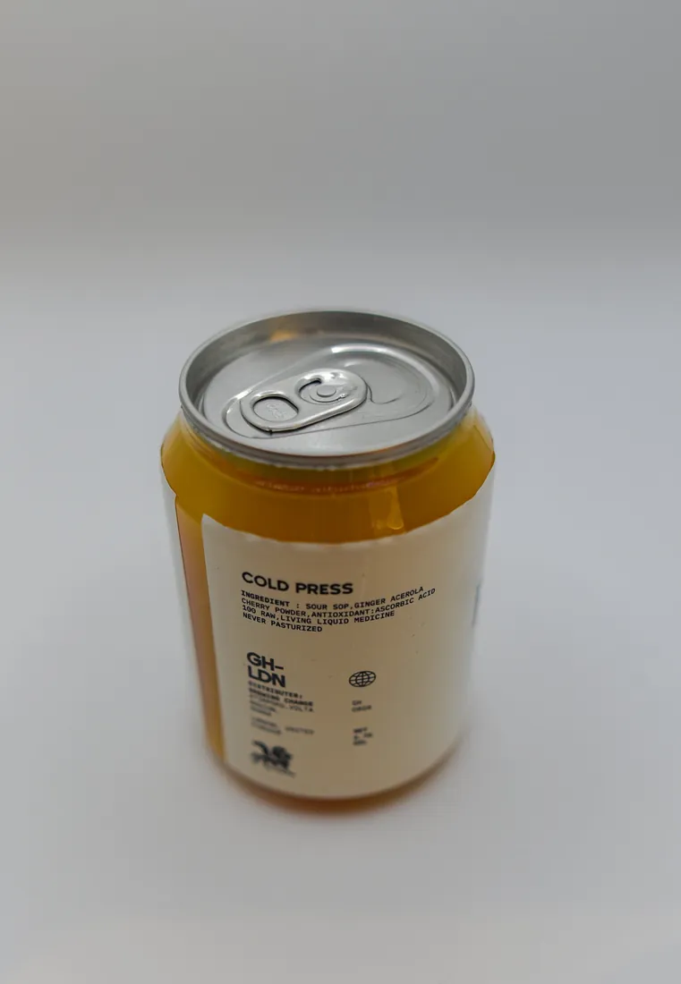 The back label of a cream Brewing Change juice can, headed Cold Press